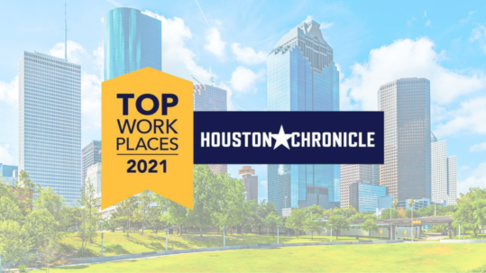 A Top Workplaces 2021 badge and Houston Chronicle logo shine over downtown Houston, celebrating Access Sciences.